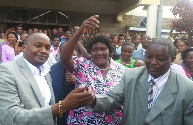 link Jaguar , Charles Kanyi, and his teacher who was gifted with a Toyota uliza